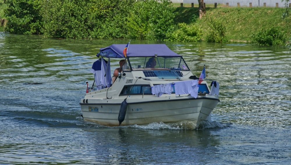 white and black yacht on body of water during daytime