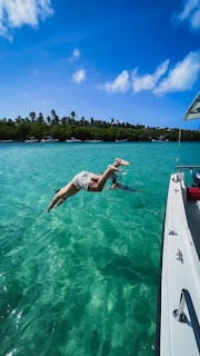 Captain Tim Neese guiding divers into crystal-clear waters near the Florida Keys.