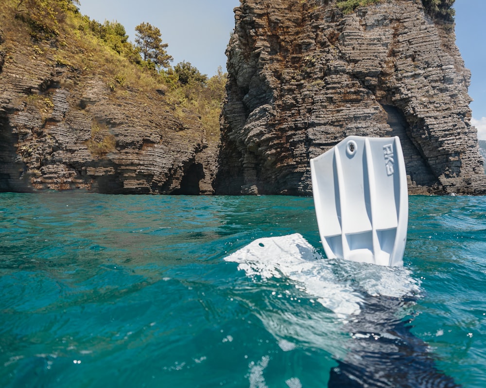 white boat on body of water during daytime