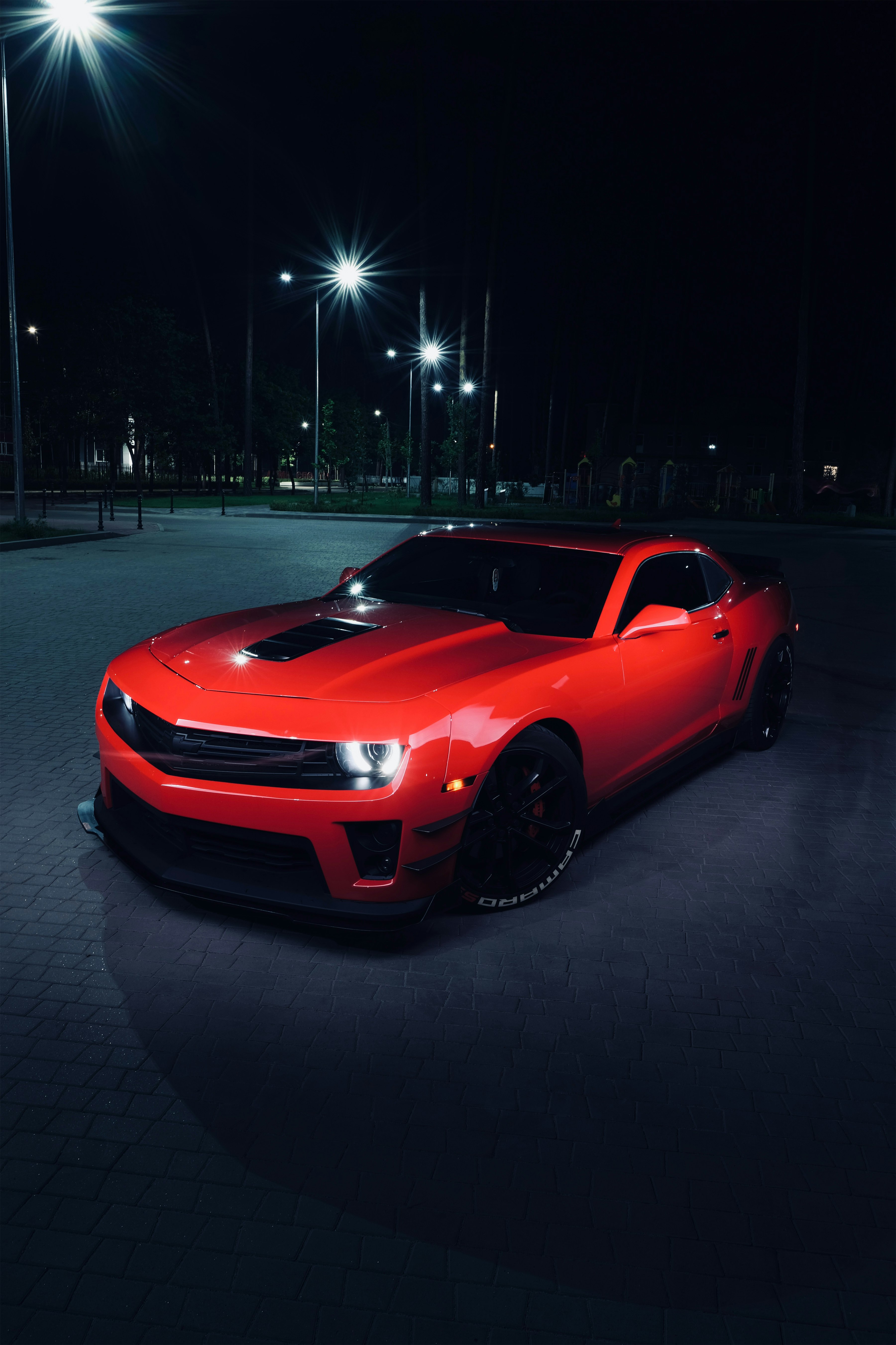 red ferrari sports car on road during night time