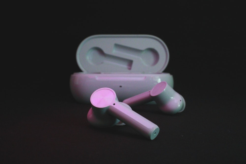 pink and white plastic tool