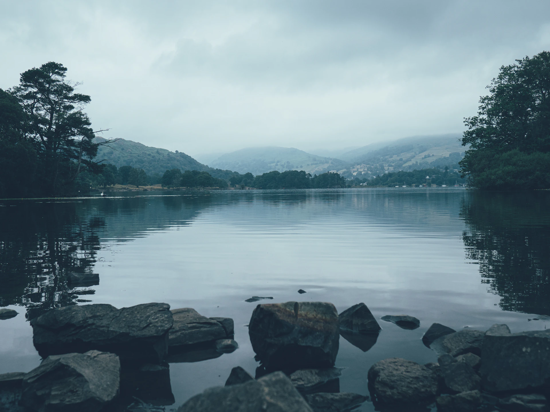 brown rocks near body of water during daytime