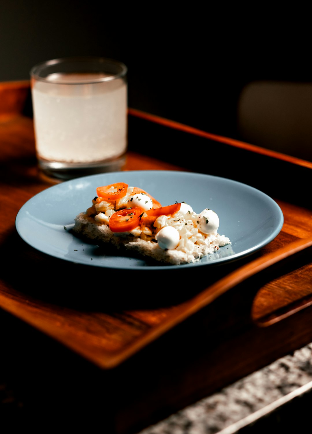 white ceramic plate with food on brown wooden table