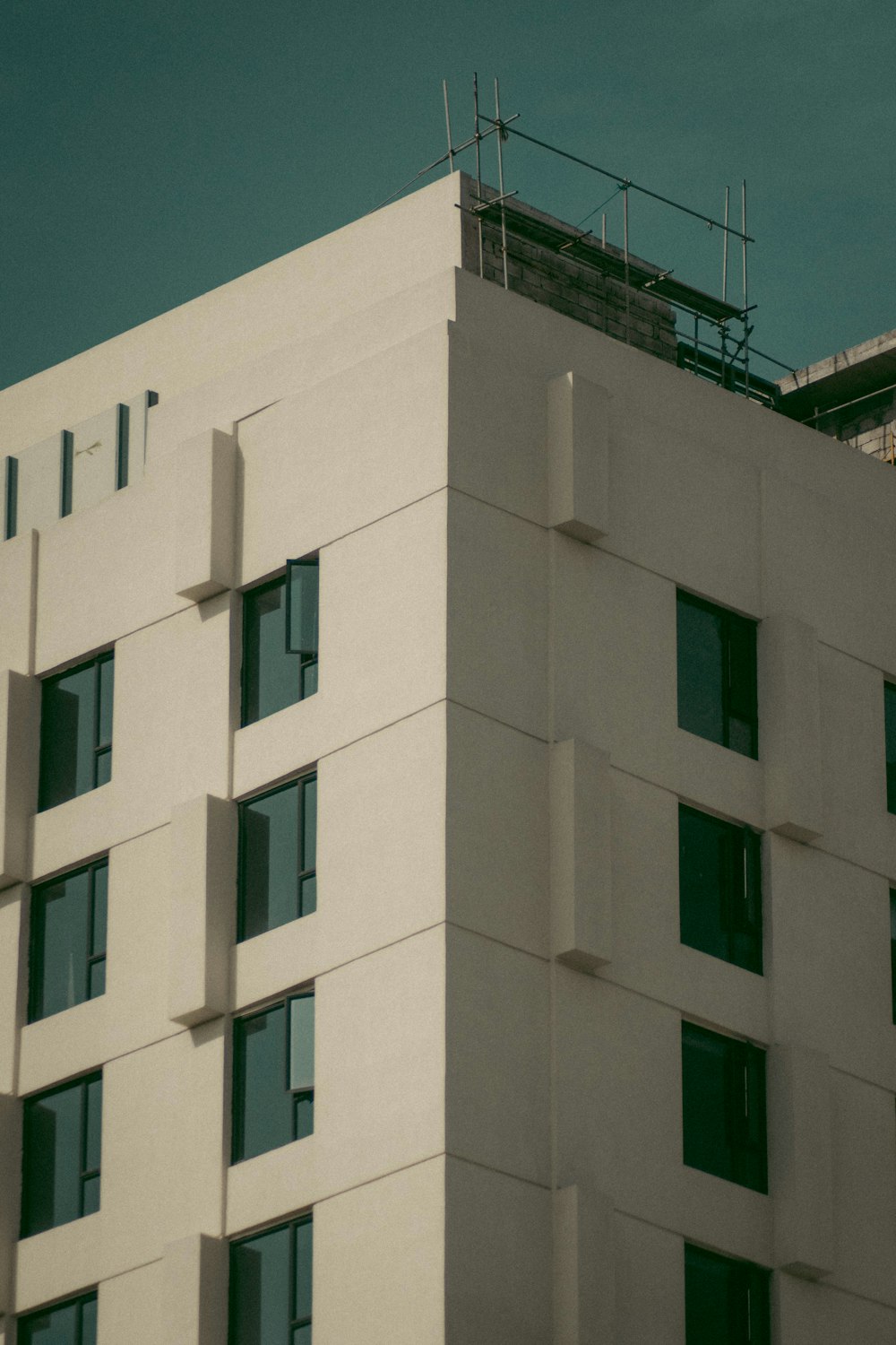 white concrete building under blue sky during daytime