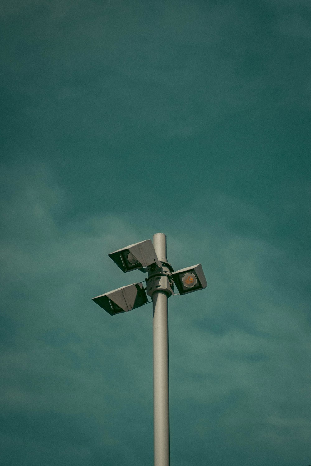 white and black wind turbine under blue sky during daytime