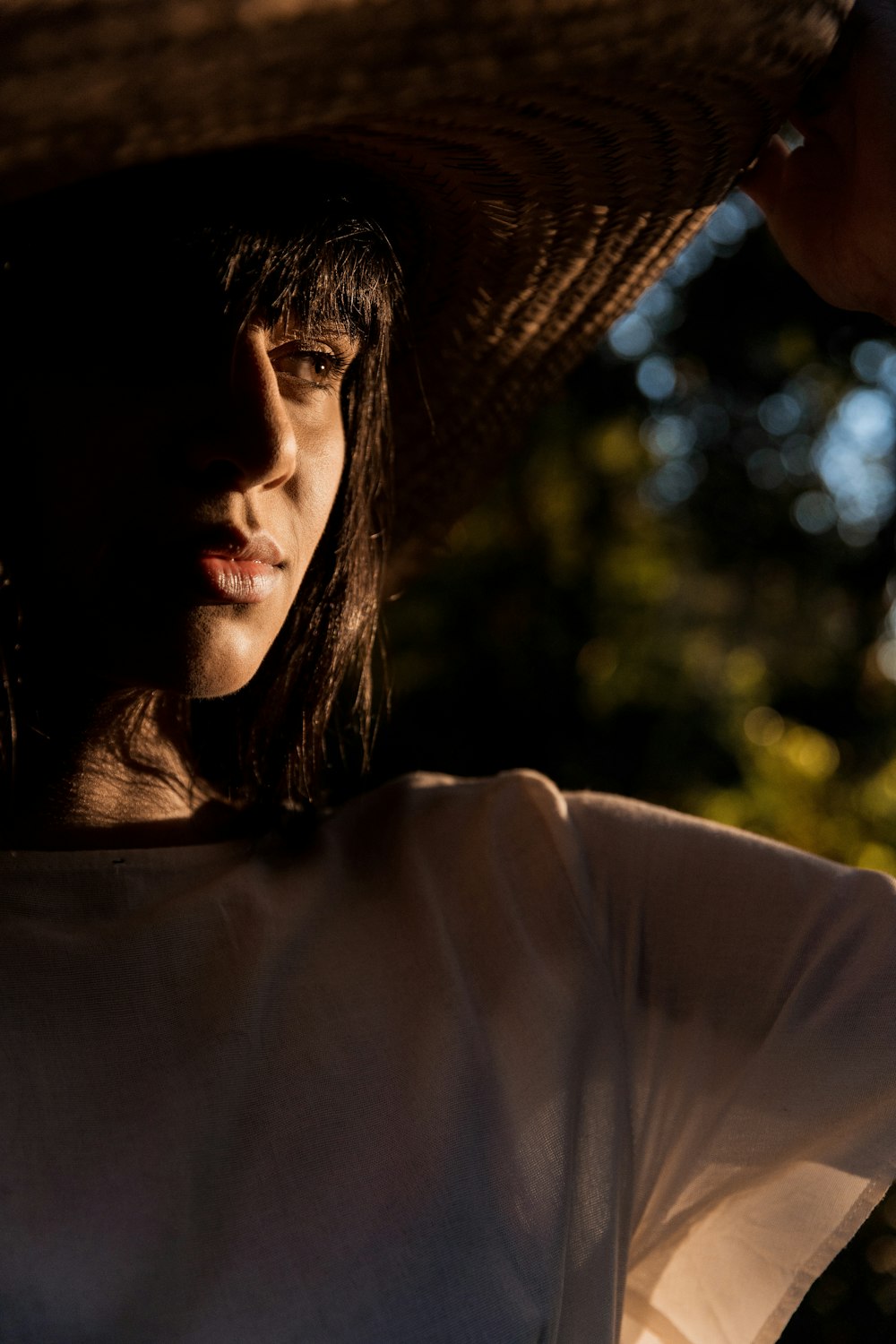 woman in brown sun hat