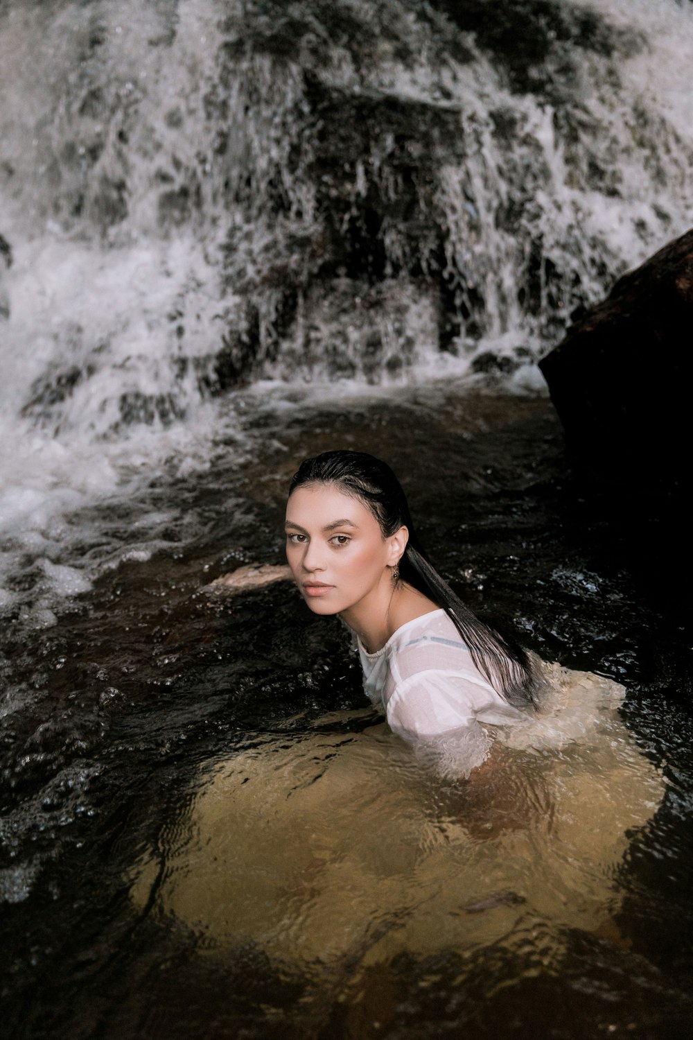 woman in white tank top on water