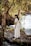 woman in white dress standing near body of water during daytime