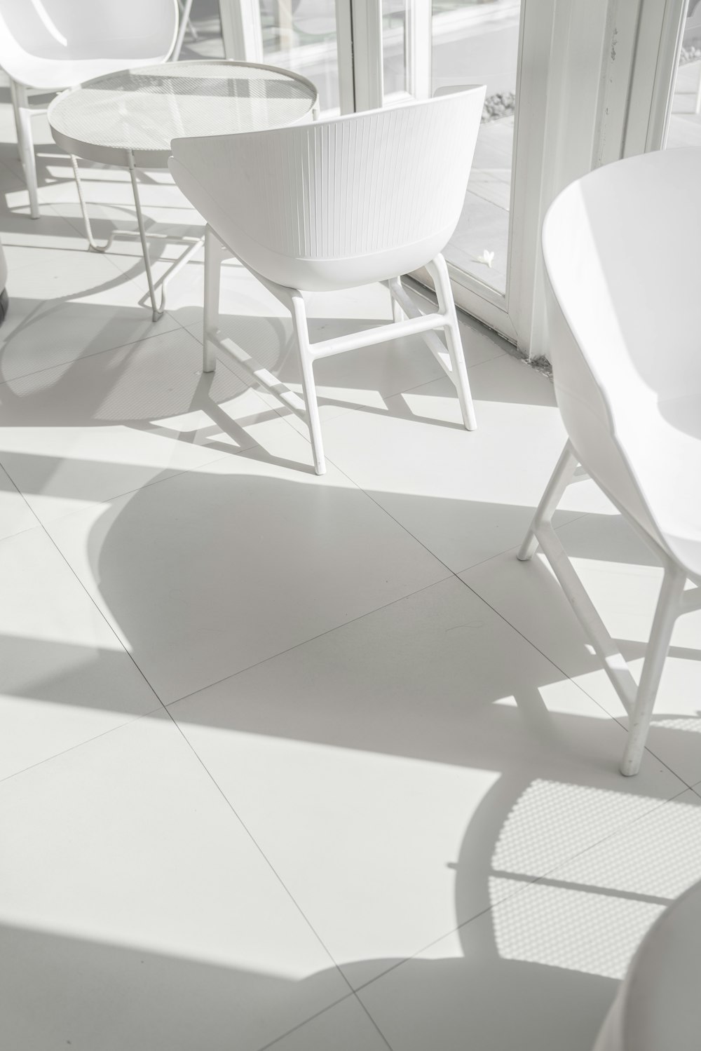 white chair on white floor tiles