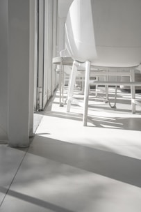 Bright, minimalist consultation room with soft natural light and Scandinavian design elements.