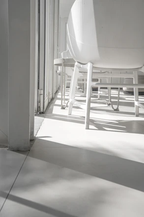 Bright, minimalist nail salon interior with elegant white and beige tones.