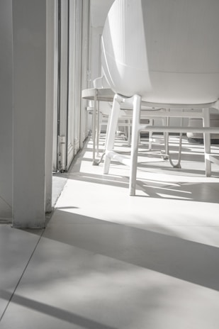 Commercial area with light-filtering white curtains creating a bright, welcoming atmosphere.