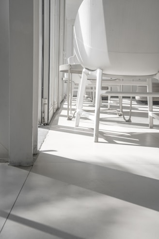 Bright hotel breakfast area with natural light and neatly arranged tables.