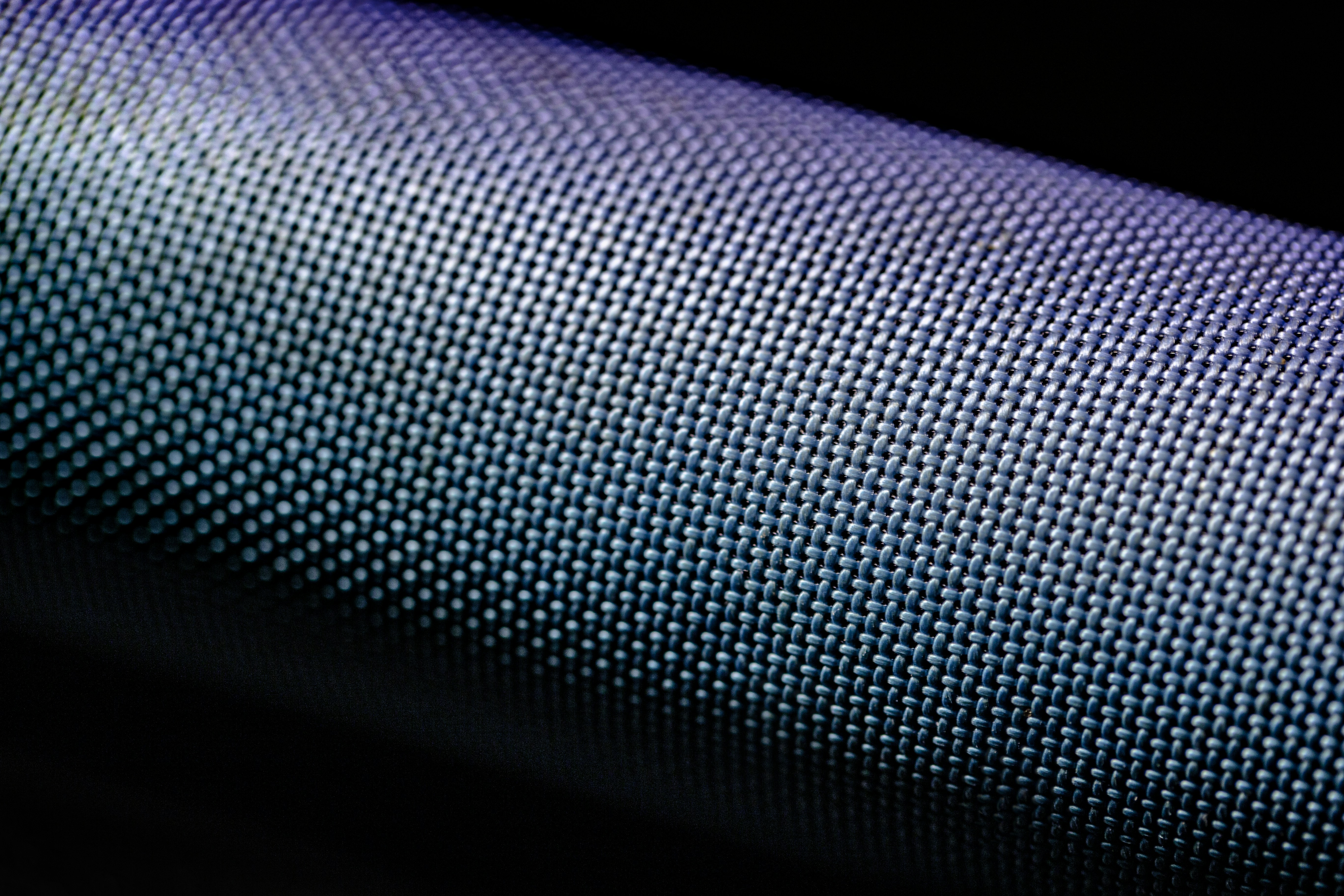 purple and black polka dot textile