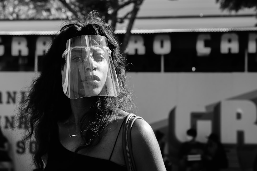 grayscale photo of woman in black tank top