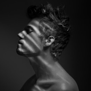 grayscale photo of womans face