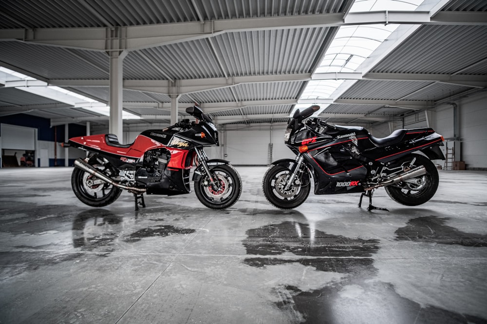 red and black motorcycle parked on garage