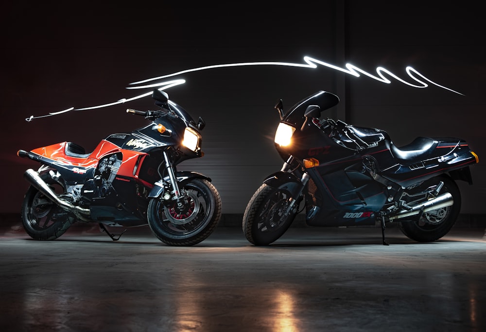 man in black and orange motorcycle suit riding on black and red sports bike