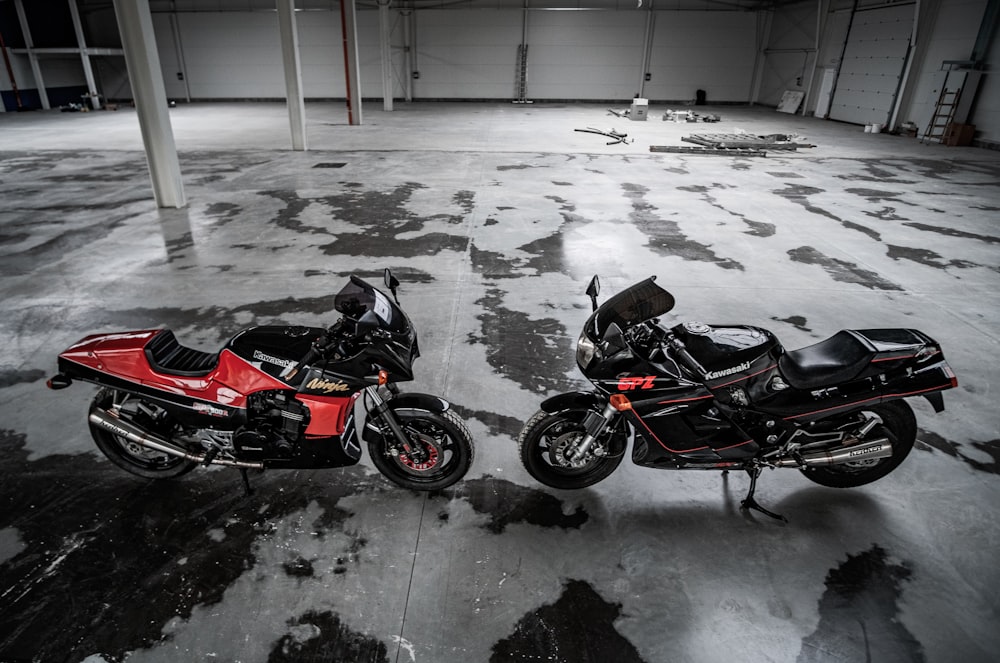 red and black sports bike on snow covered ground