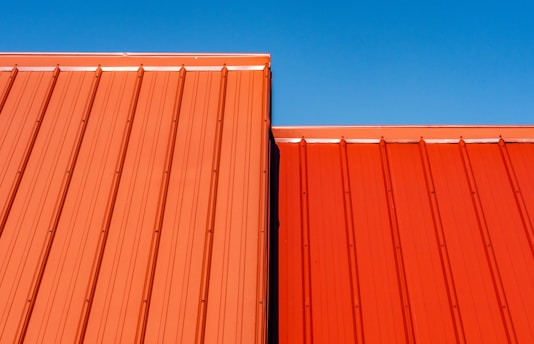 brown wooden wall under blue sky during daytime