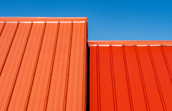 brown wooden wall under blue sky during daytime