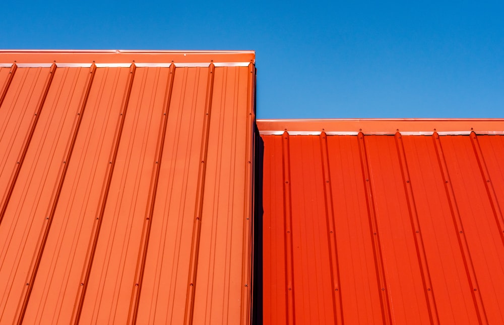 brown wooden wall under blue sky during daytime