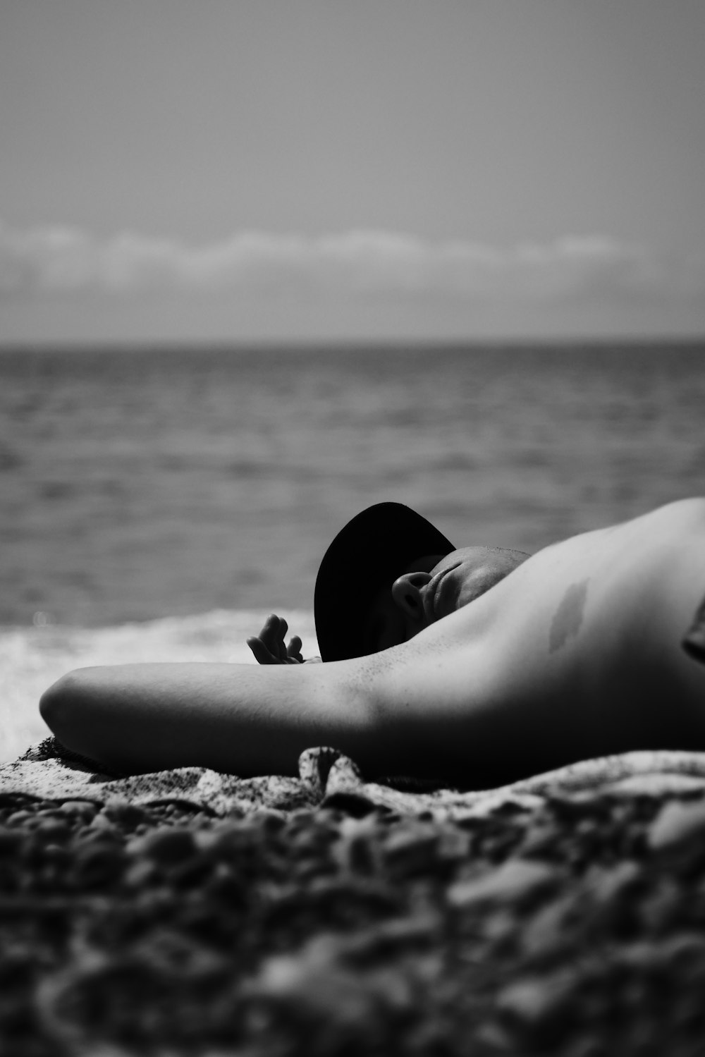 woman lying on beach shore