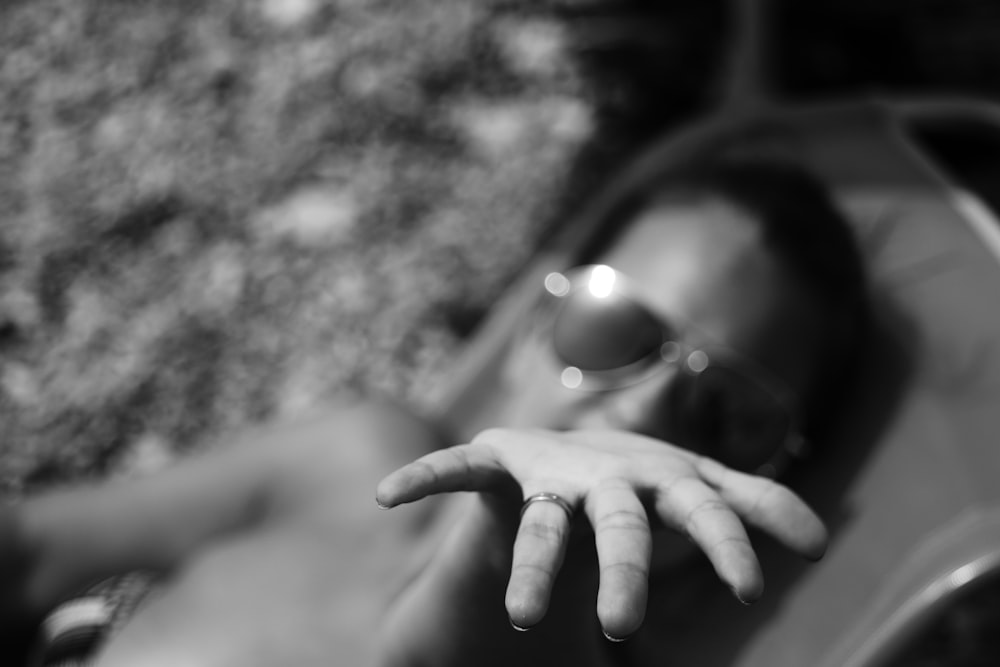 grayscale photo of woman wearing sunglasses