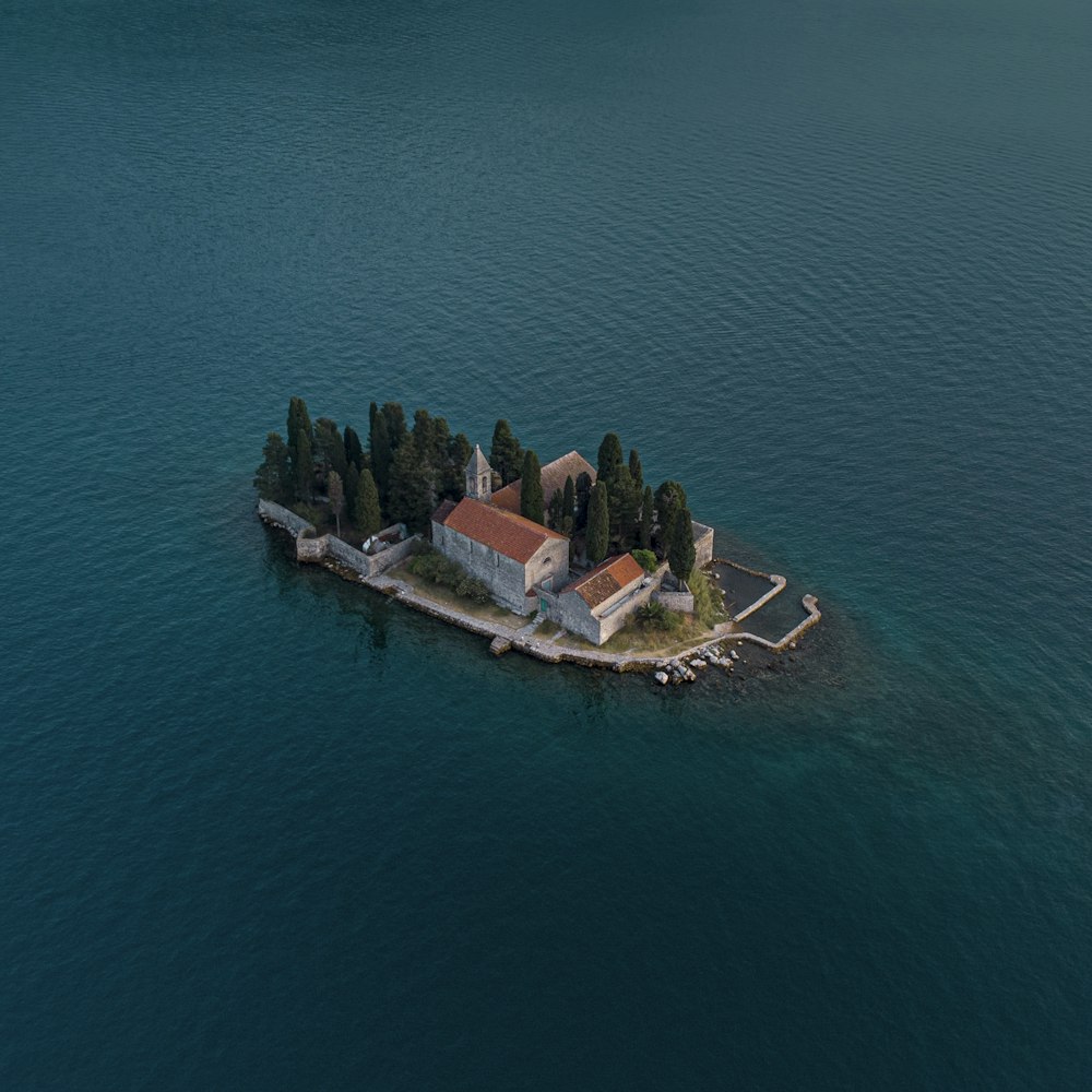 aerial view of brown and white boat on blue sea during daytime