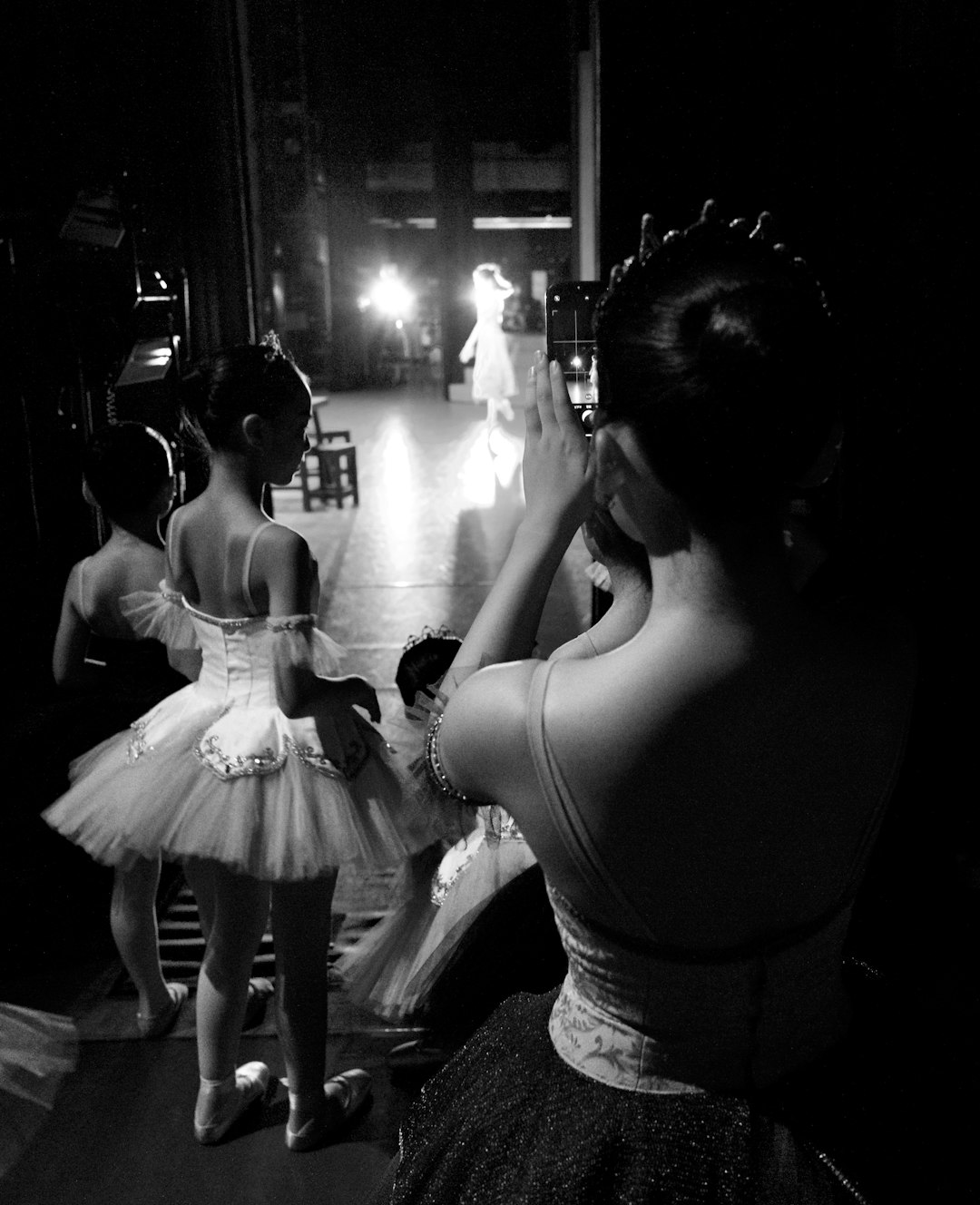 woman in white dress kissing woman in white dress