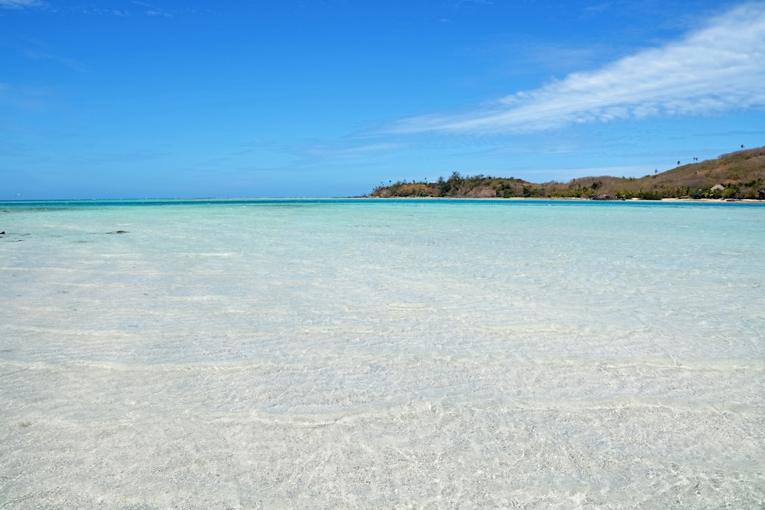 blue sea under blue sky during daytime