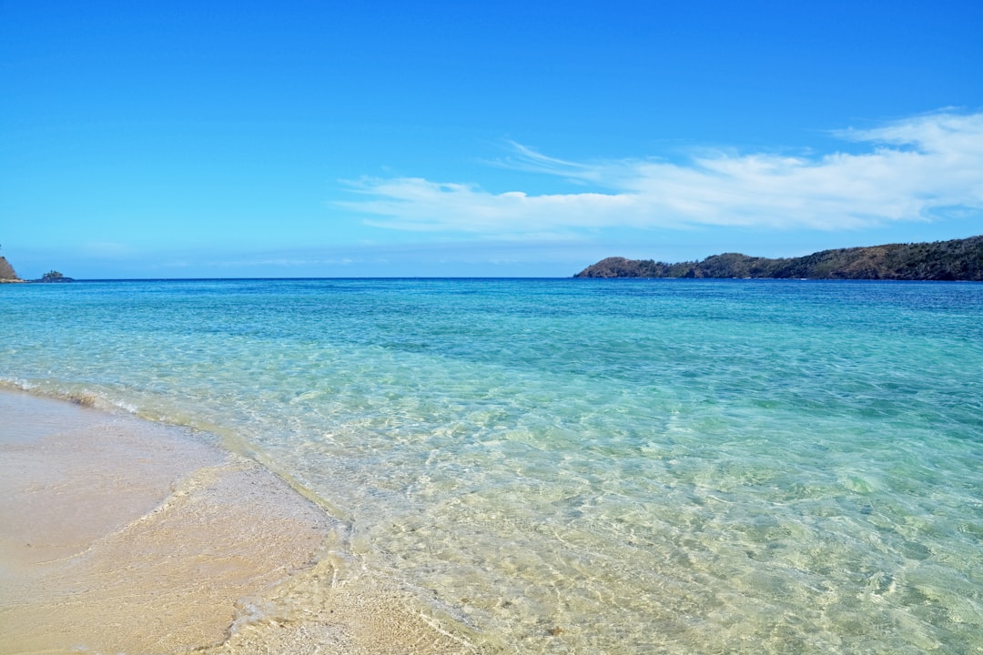 blue sea under blue sky during daytime