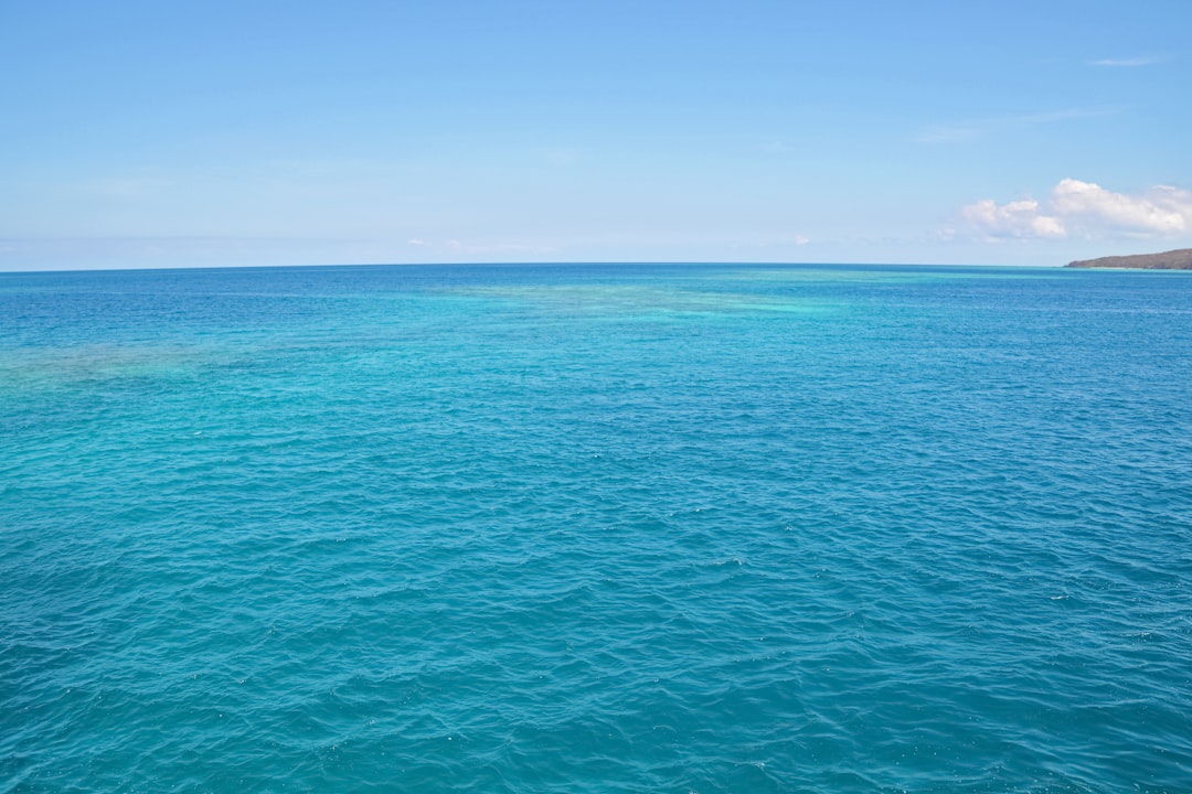 blue sea under blue sky during daytime