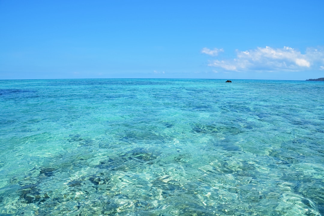 blue ocean water under blue sky during daytime