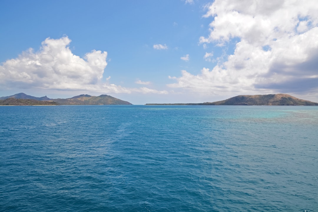 blue sea under blue sky during daytime