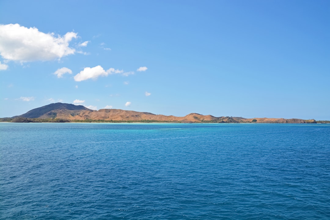 blue sea under blue sky during daytime