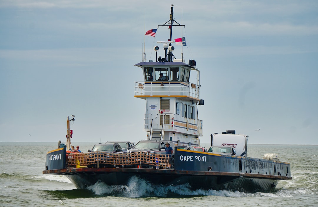 white and black ship on sea during daytime