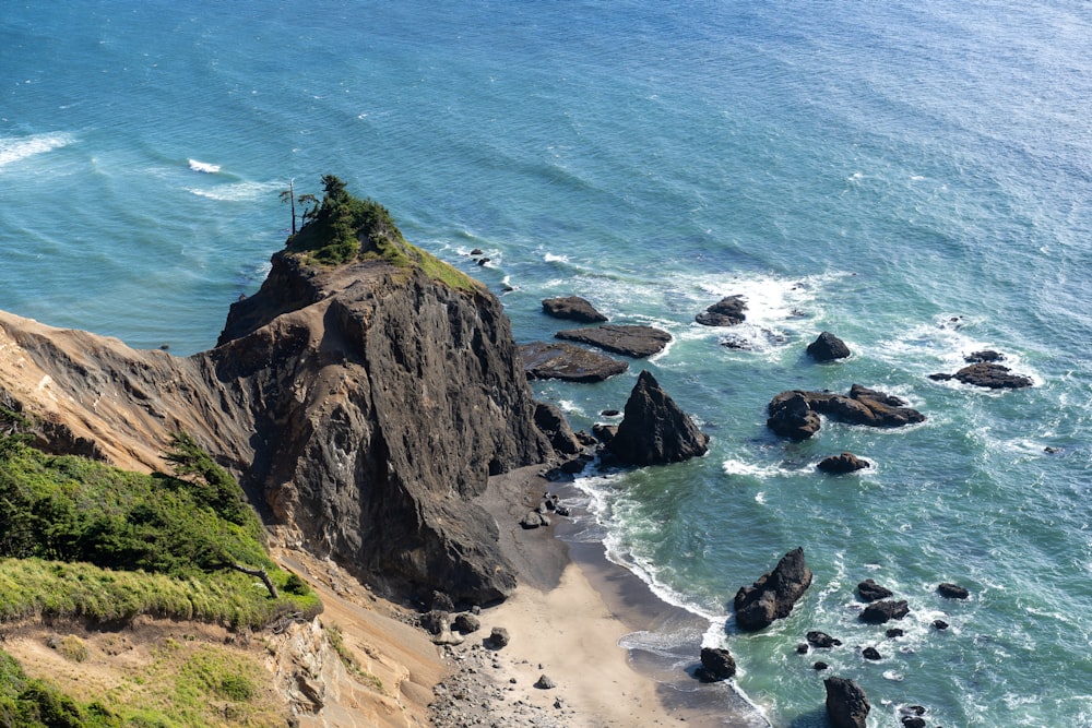 brown rock formation on sea shore during daytime