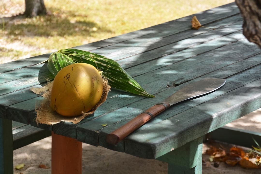 yellow round fruit on brown wooden table