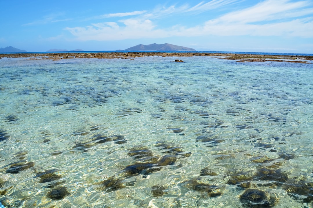 blue sea under blue sky during daytime