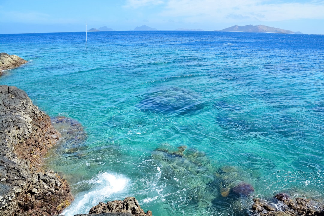 blue sea under blue sky during daytime