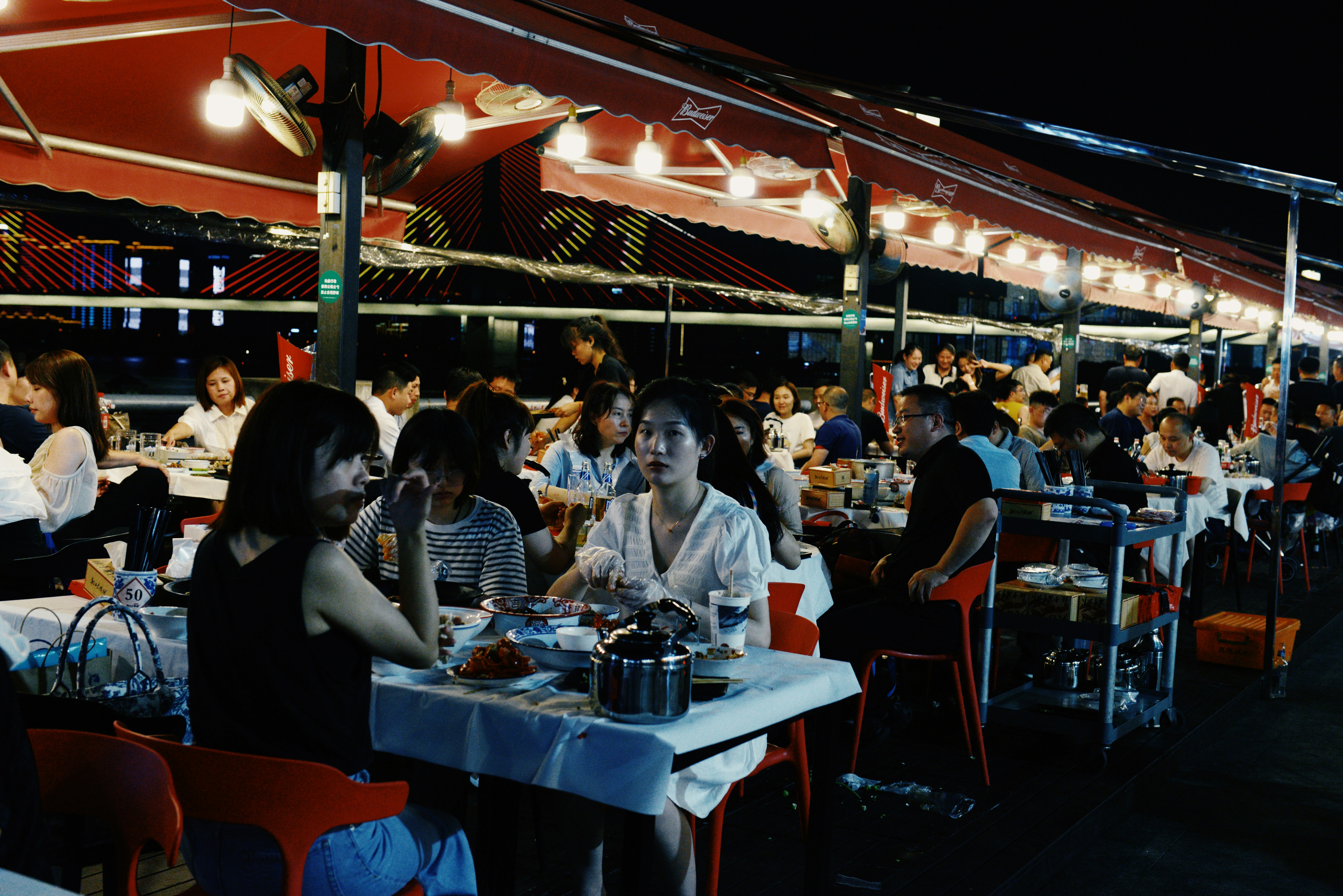 People dining outdoors on Restaurant Row in the West Loop - lofts in west loop chicago
