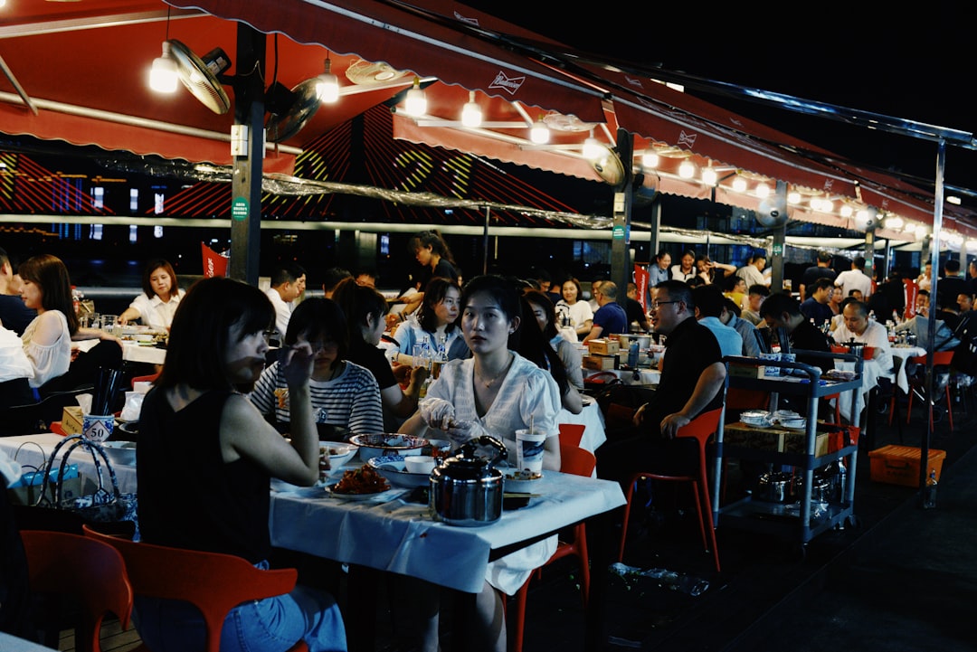 people sitting on chair near table during night time