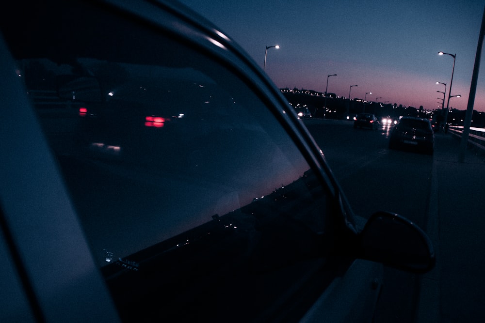 car on road during night time