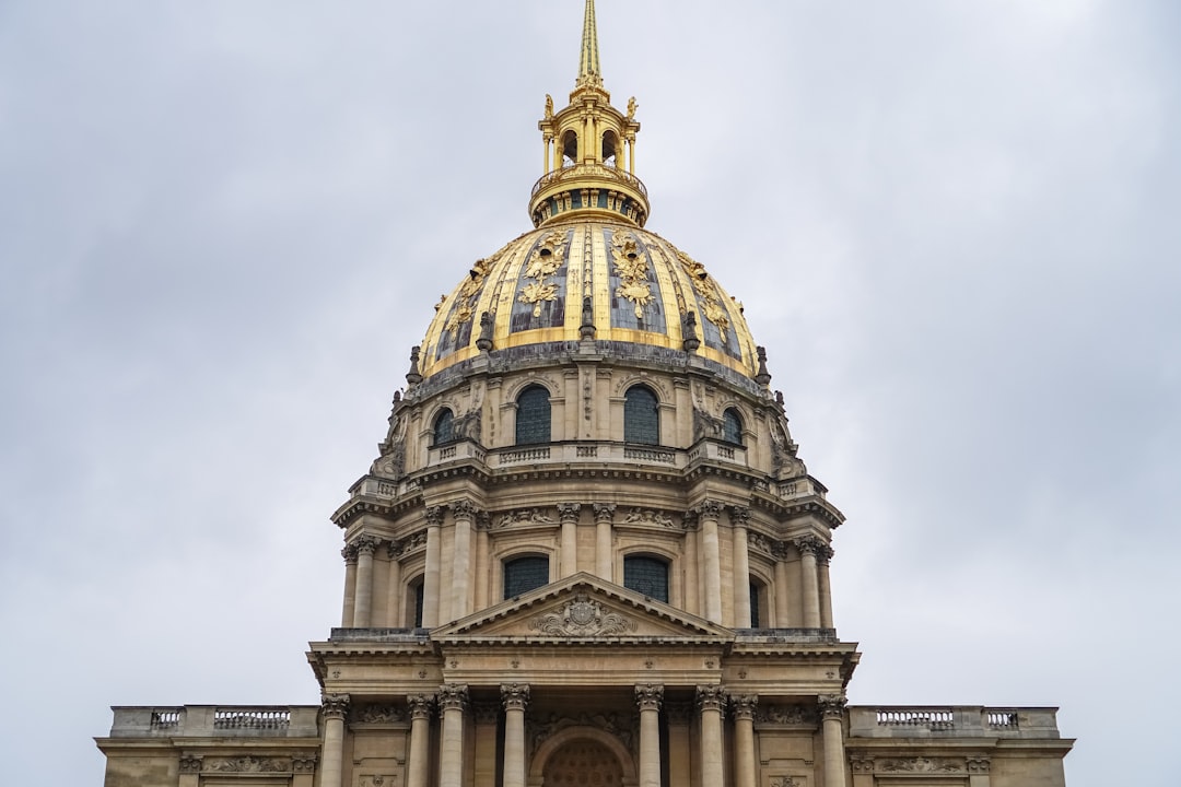 brown and beige dome building under white clouds during daytime