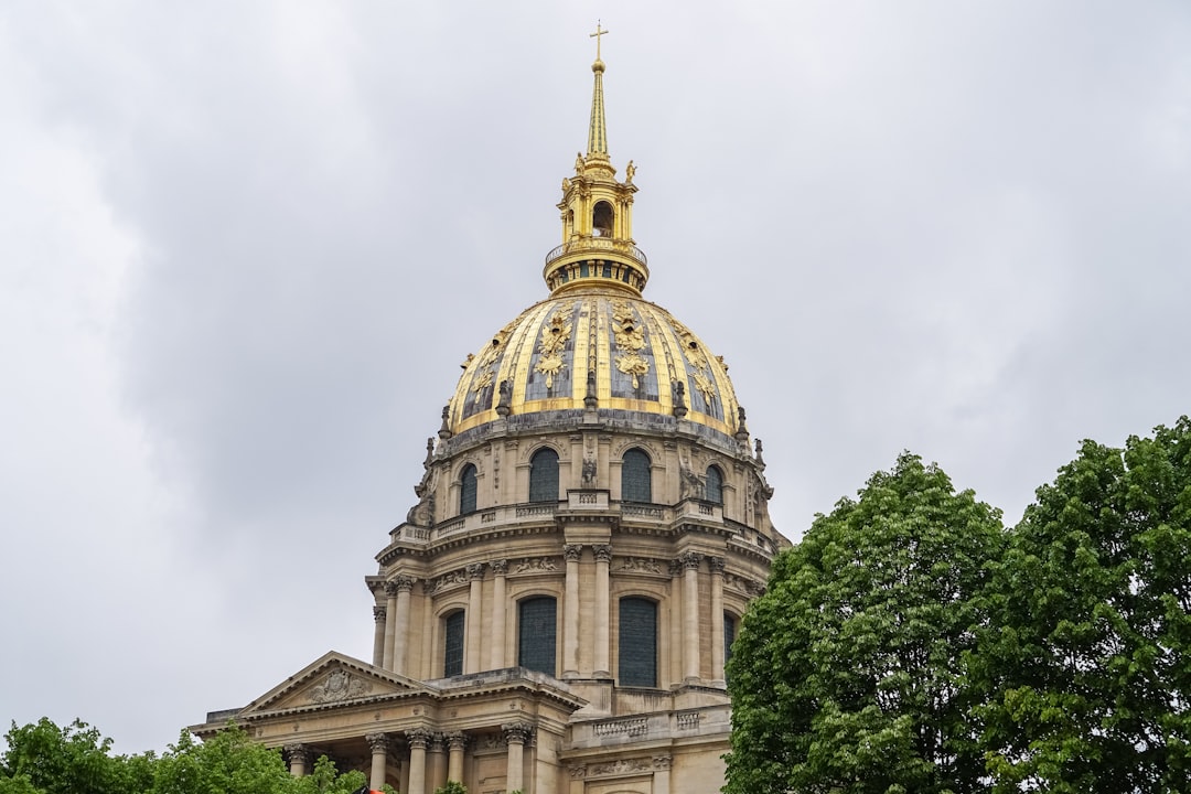 brown concrete dome building under white clouds during daytime