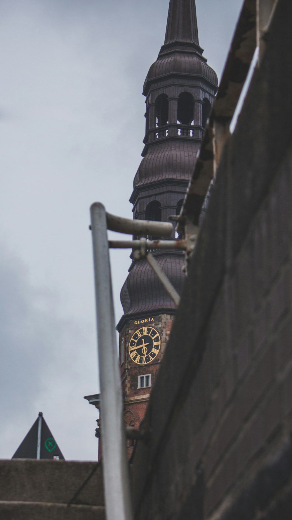 brown and black tower with clock