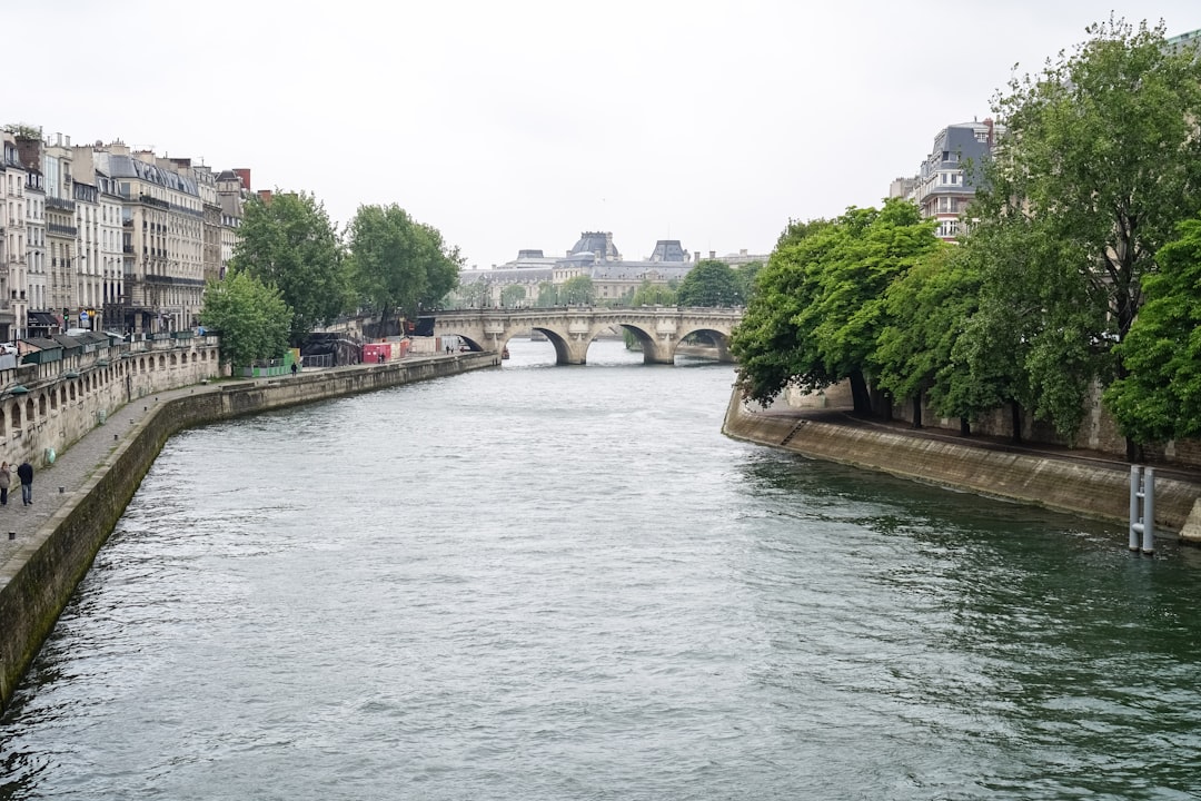 gray concrete bridge over river