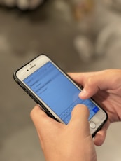 person holding silver iphone 6
