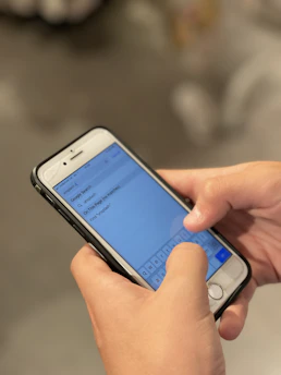 person holding silver iphone 6